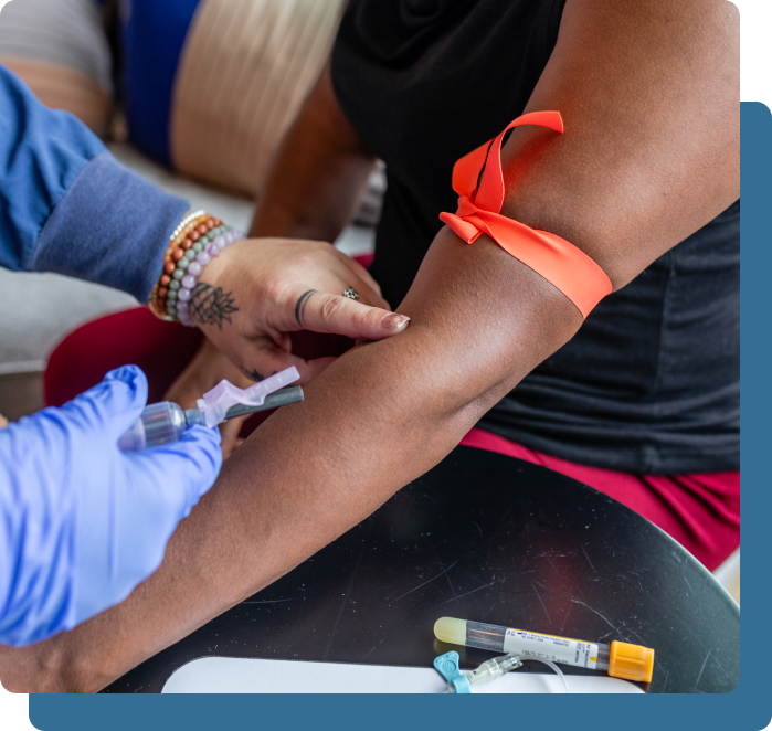 A person is getting their arm examined by an expert.